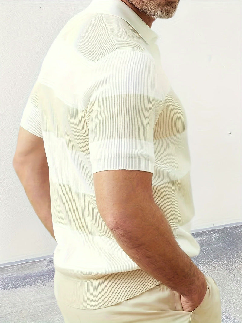 Man wearing a beige short-sleeve knit shirt against a light background