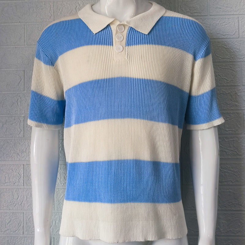 Blue and beige striped polo shirt on a mannequin against a gray textured wall.
